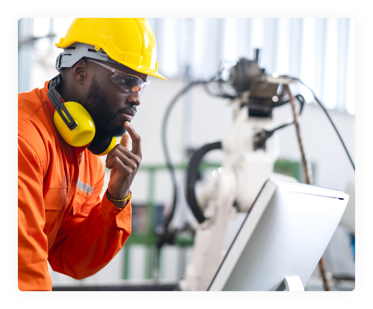 portrait-native-american-engineer-technician-wearing-safty-uniform-hand-contril-automation-robot-arm-welding-machine-with-laptop-industrial-40-factory-background-concept